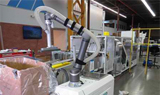 Muller unveils first self-contained cobot case packer