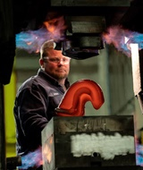 Utilizing forging press to reduce costs of titanium parts